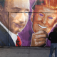 A mural depicting a winking Vladimir Putin taking off his Donald Trump mask is painted on a storefront outside the Levee bar in New York City on Feb. 25, 2017. The mural, painted by Damien Mitchell, is in Brooklyn’s Williamsburg neighborhood. (Spencer Platt/Getty Images)